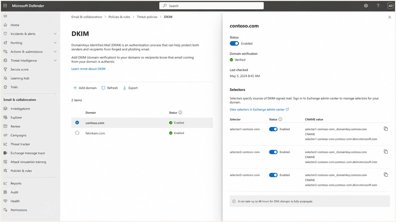 Microsoft Defender portal DKIM setup screen with domain selector status and CNAME values.