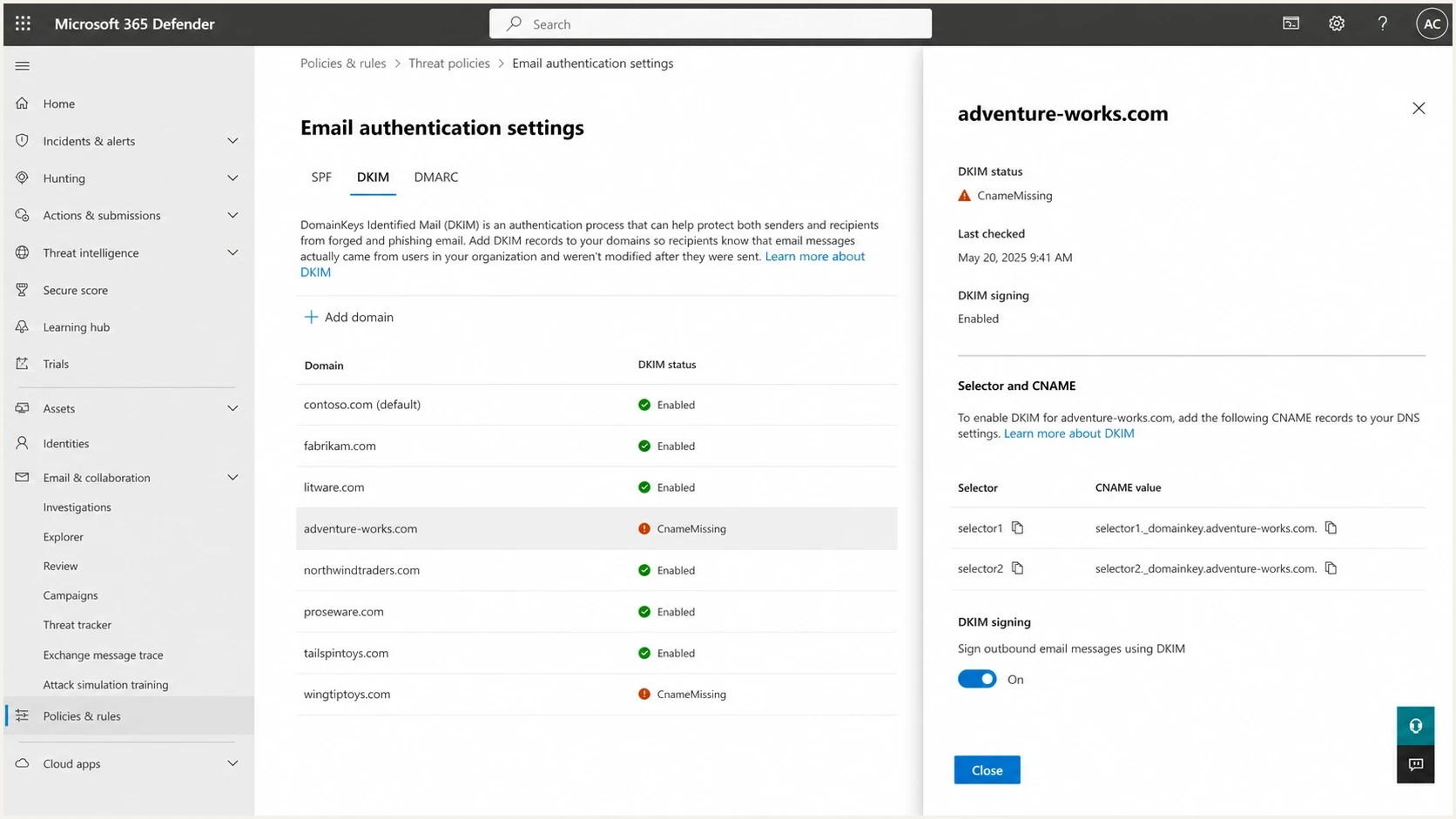 Microsoft Defender portal DKIM tab showing domain status and selector CNAME values.
