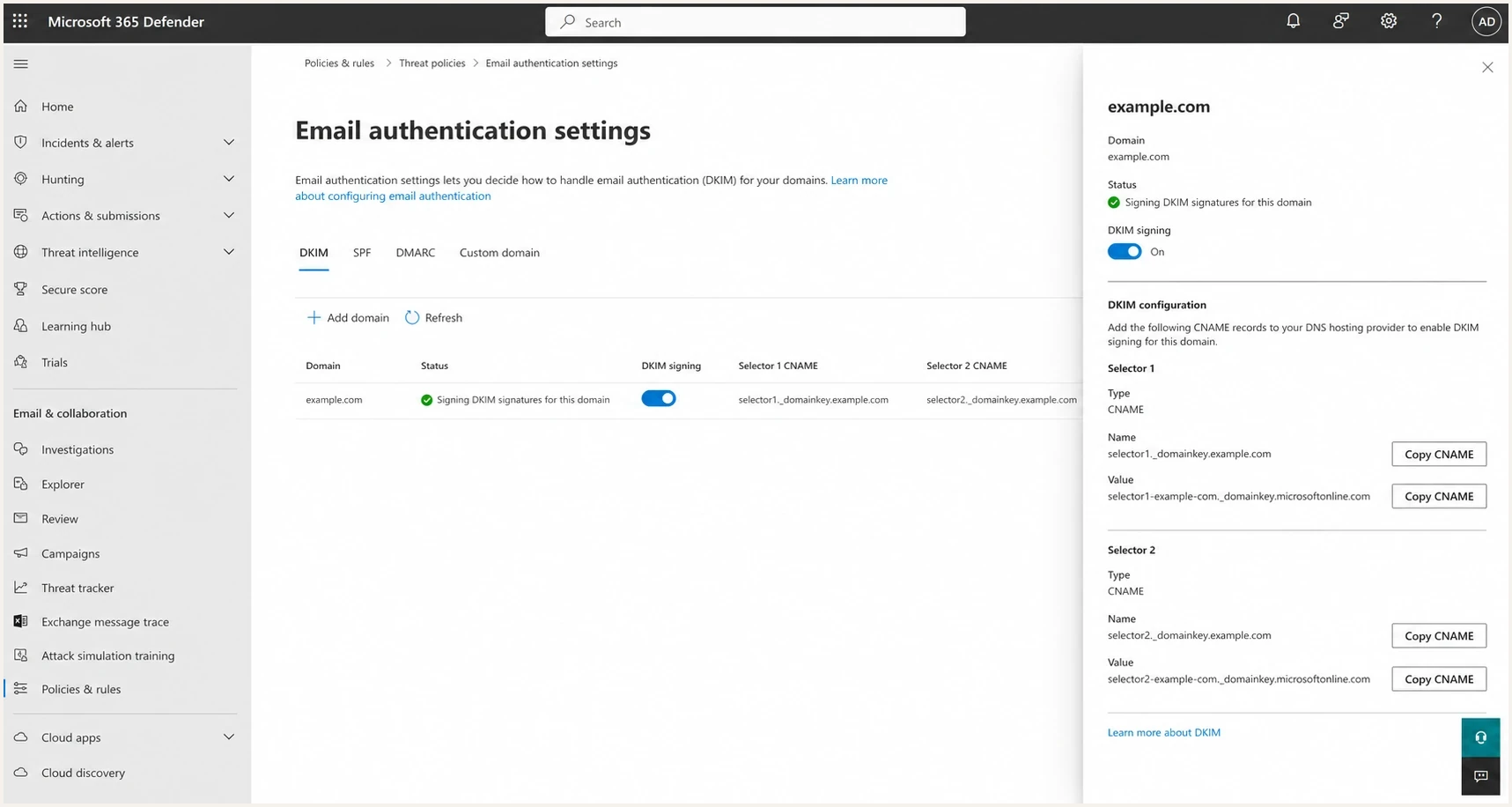 Microsoft Defender portal DKIM tab with custom-domain signing enabled.