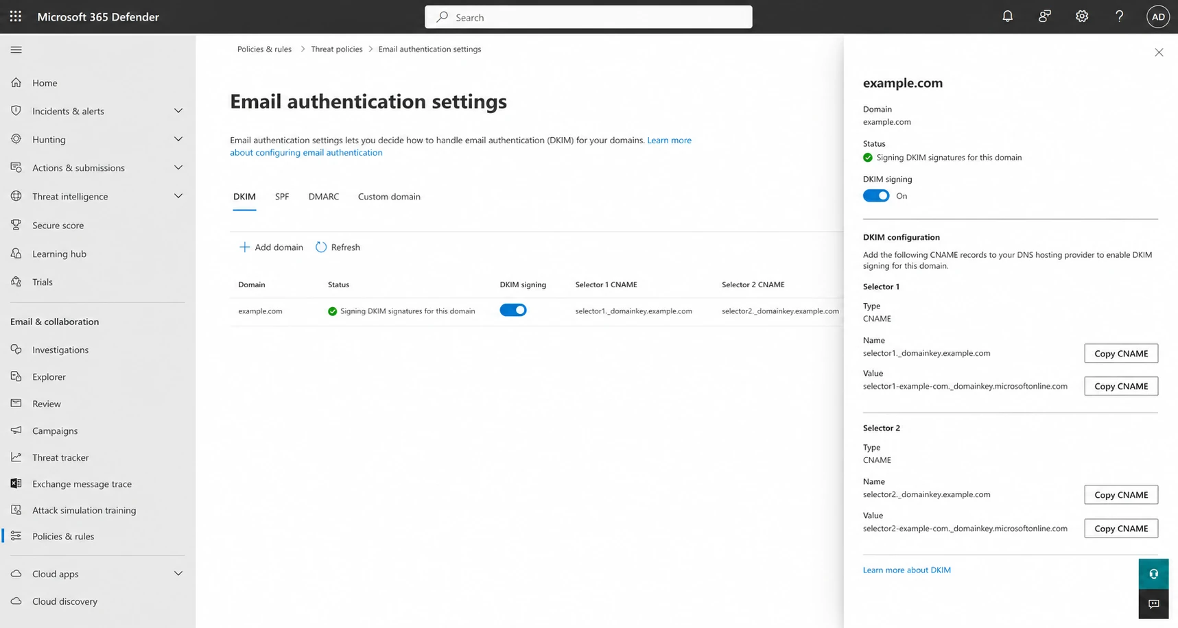 Microsoft Defender portal DKIM tab with custom-domain signing enabled.